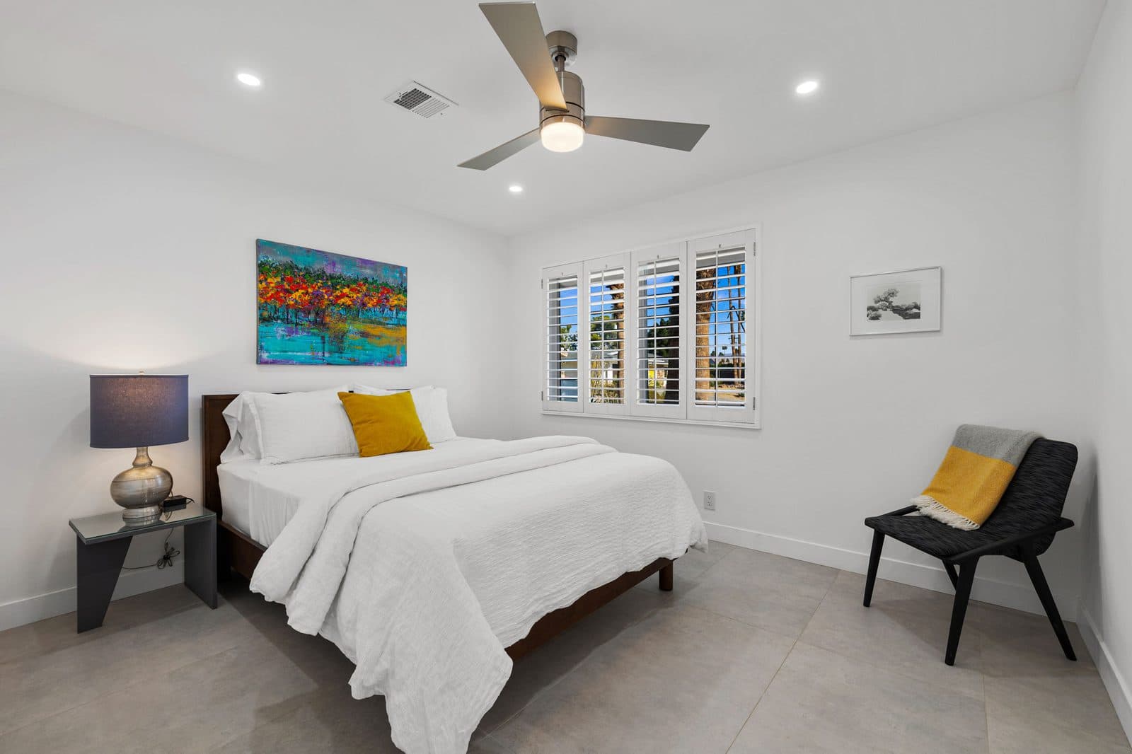 Guest bedroom with vibrant desert artwork