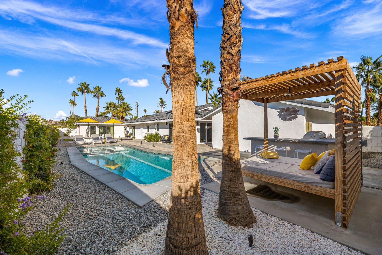 Cabana daybed shaded by palms