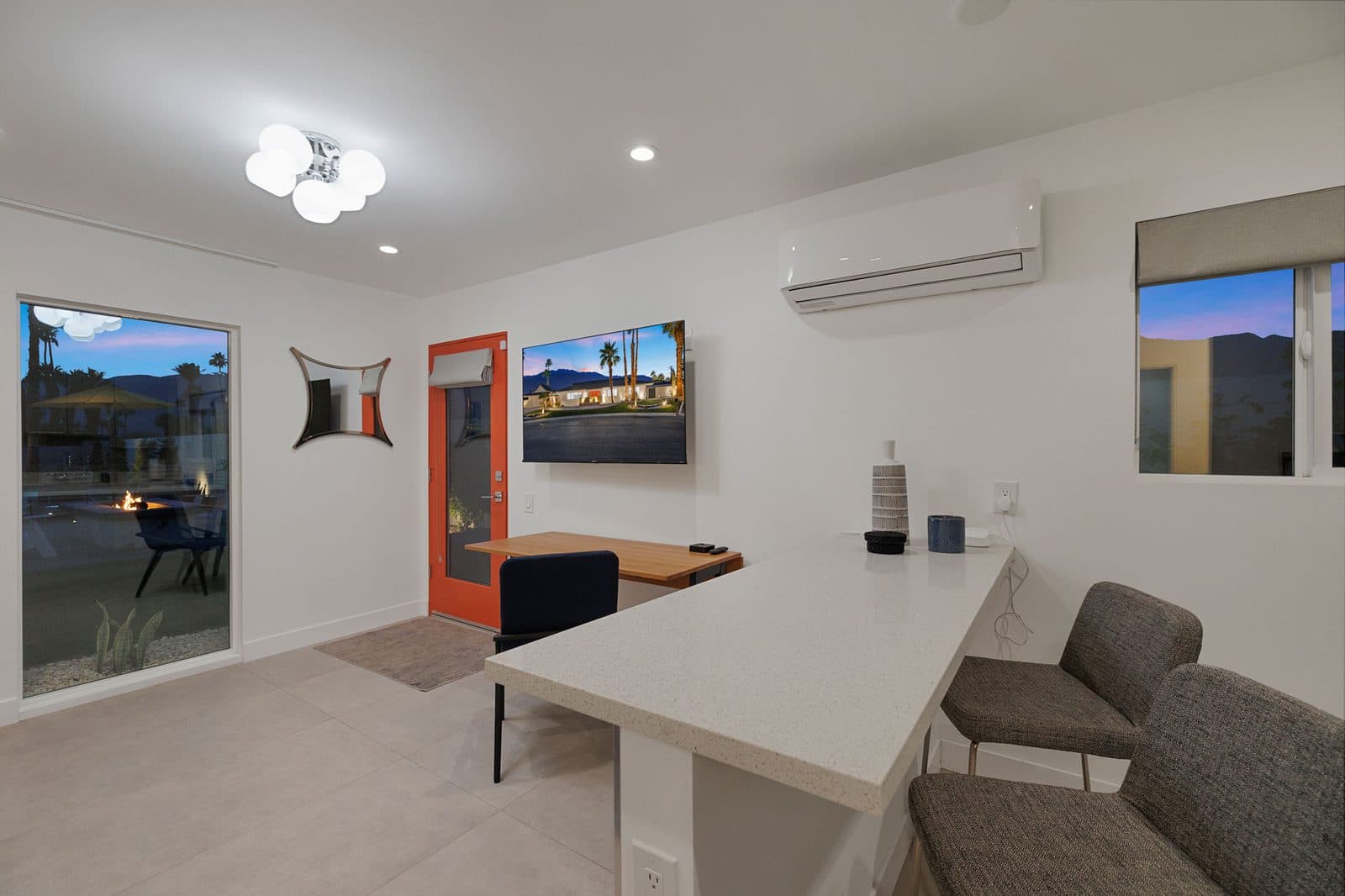 A dedicated workspace in the casita: a real desk, its own entrance and air conditioning, plus a kitchenette with mini fridge and microwave. Work a few hours, then step out to the pool.