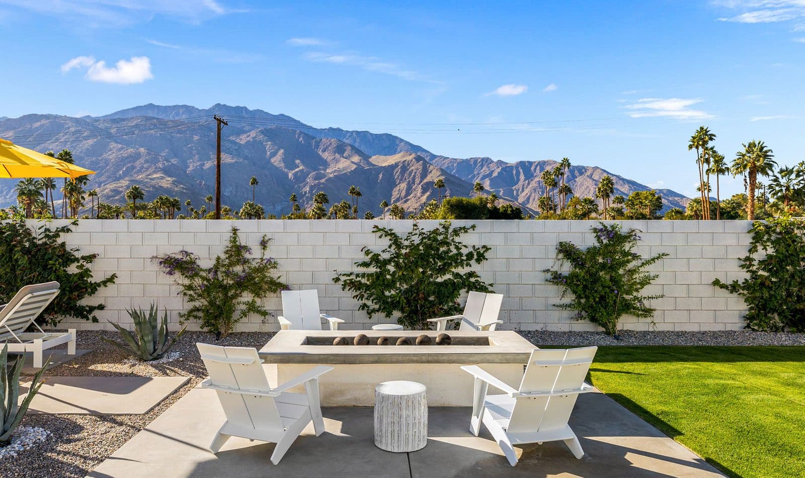 The gas fire pit, with Adirondack chairs facing the mountains