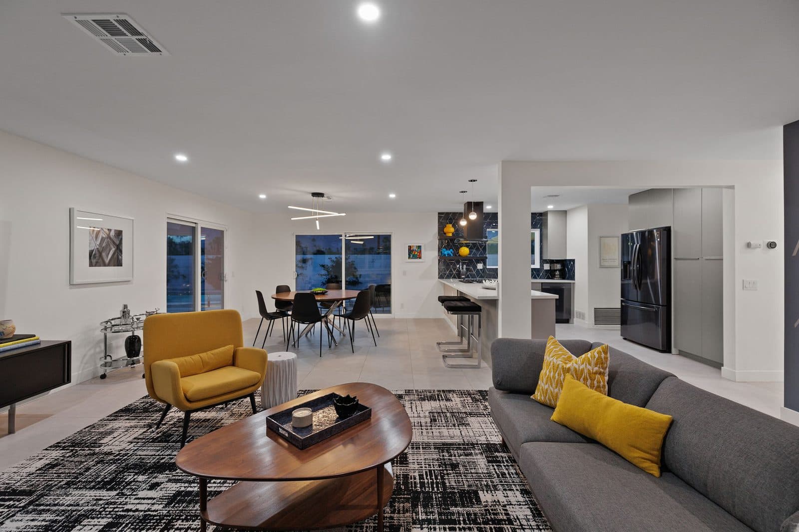 Open great room with sectional and mid-century accents