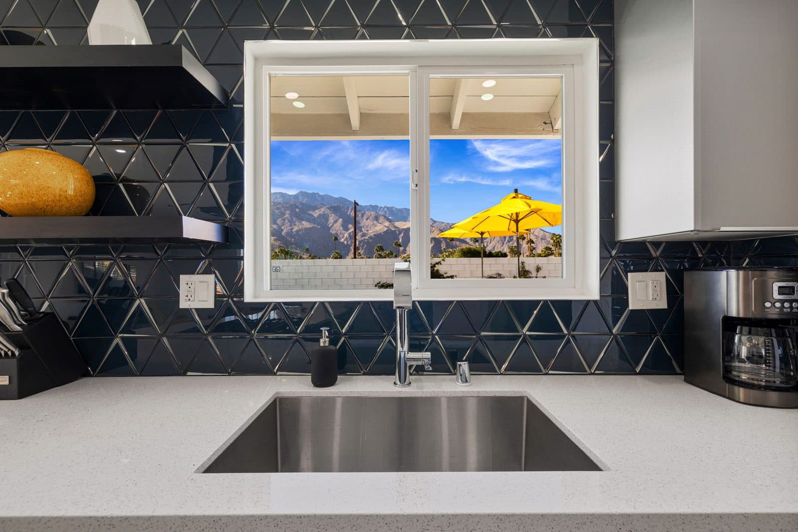 Kitchen window framing the San Jacinto Mountains